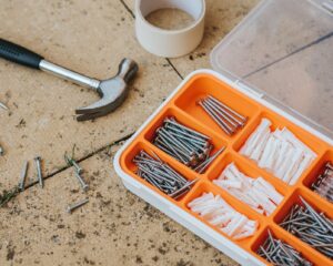 Box of screws and hammer